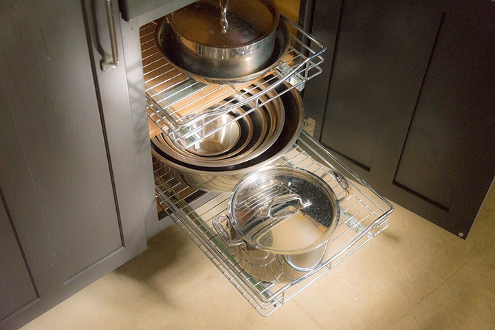 stainless steel pull-outs in base cabinets store far more than standard fixed shelving, so that base cabinets alone can store as much as an entire conventional kitchen