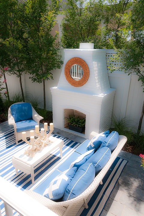 classic Hearth Garden nestles around white brick outdoor fireplace at the 2011 Coastal Living Idea House