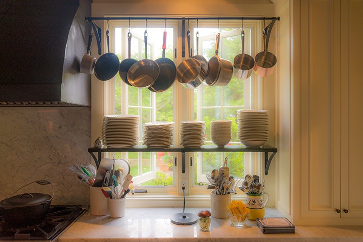open casement windows on a kitchen wall brighten the workspace dramatically, and provide a gentle breeze to cool the kitchen on a late spring day