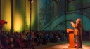 Andrés Duany speaking to a packed house at Silo City in Buffalo, New York with urban images flashing on the silo walls beyond